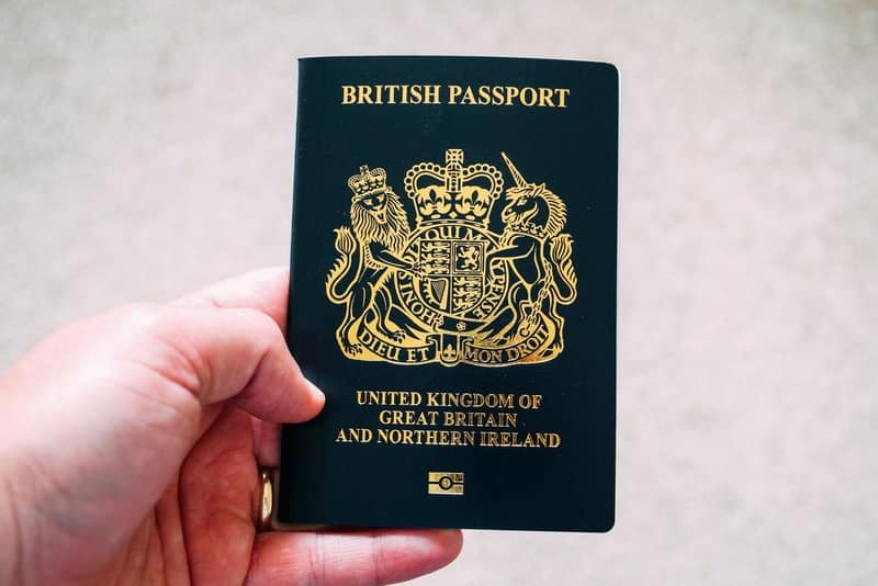 A person holding an open British passport